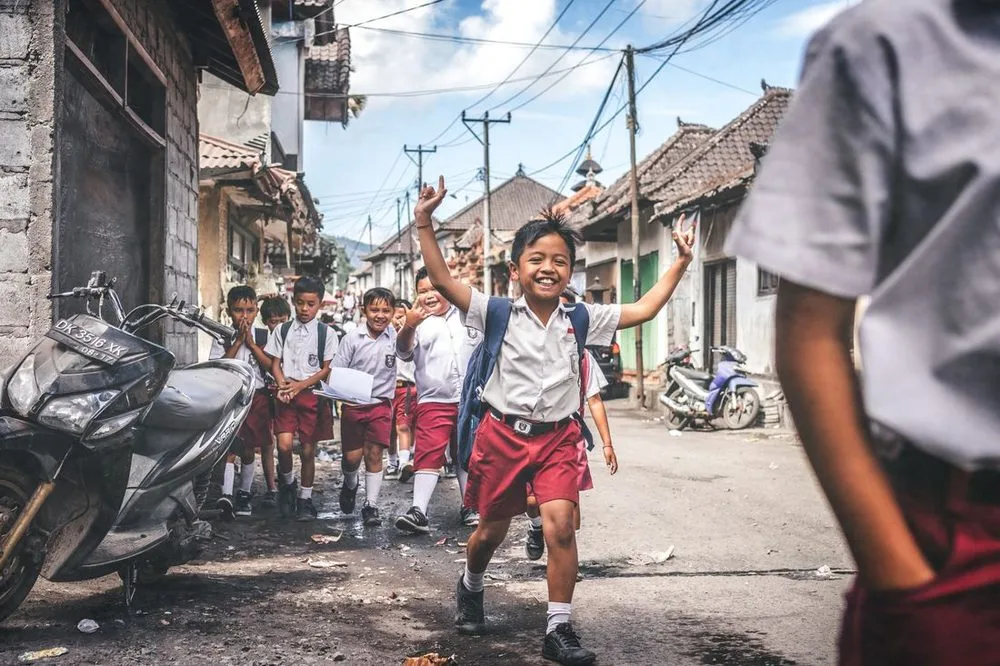 Children celebrating joyfully on their neighborhood street