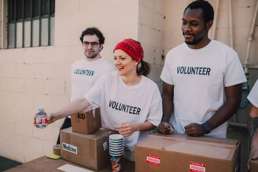 Volunteers handing out supplies together